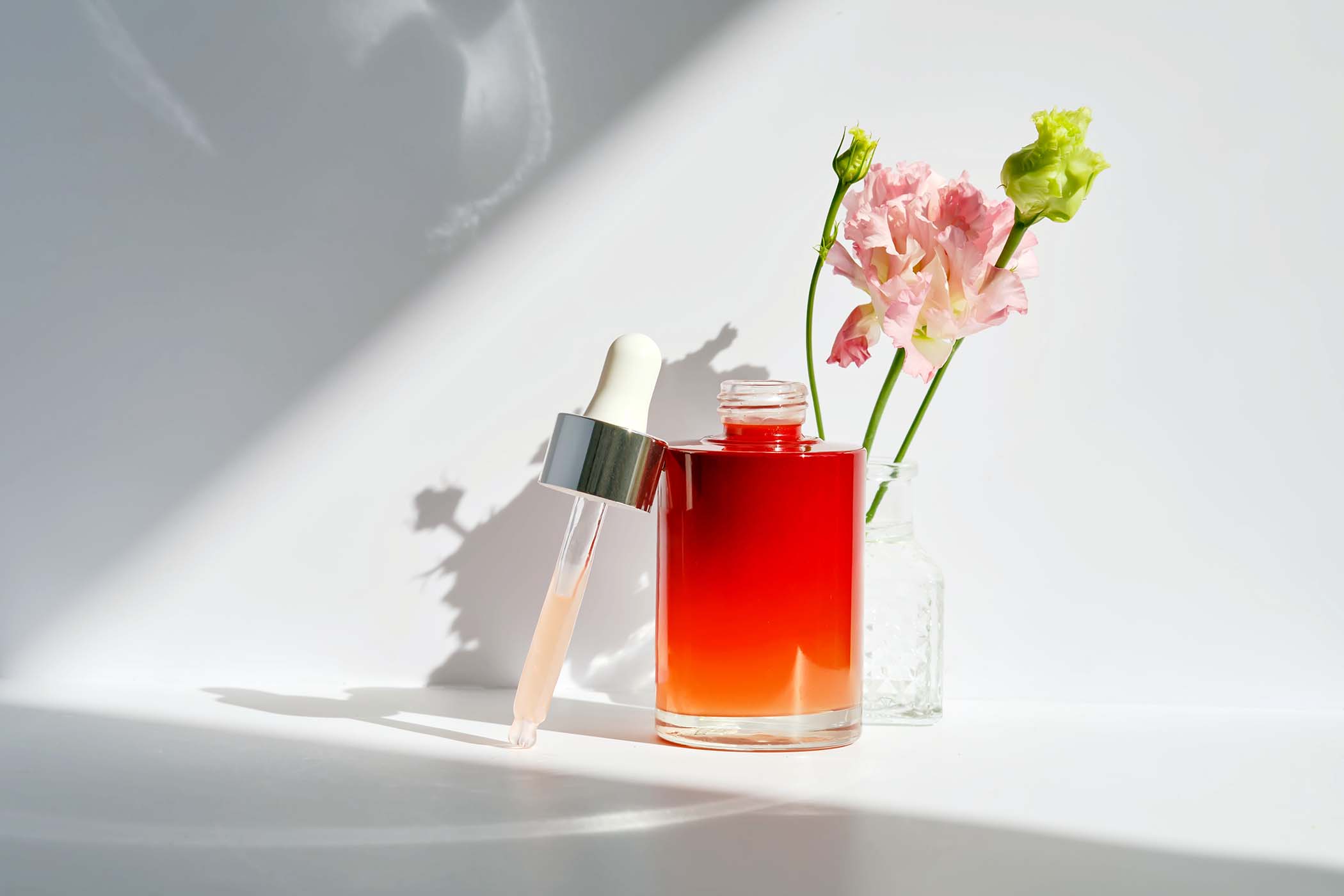 serum-with-a-dropper-with-spring-flowers-BR53RRX.jpg